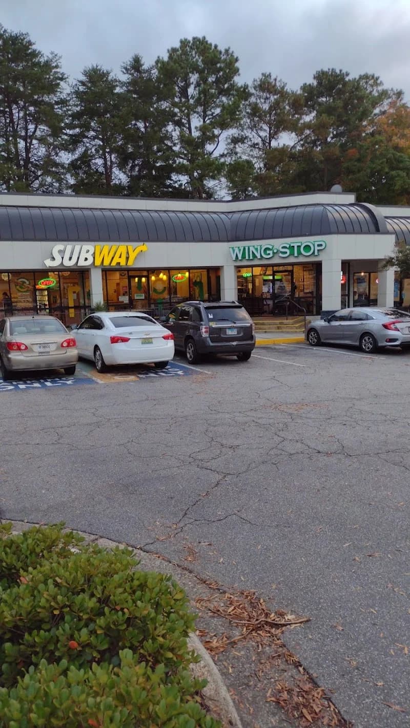 Wingstop storefront outside and inside view at 5920 Roswell Road in Sandy Springs, Georgia
