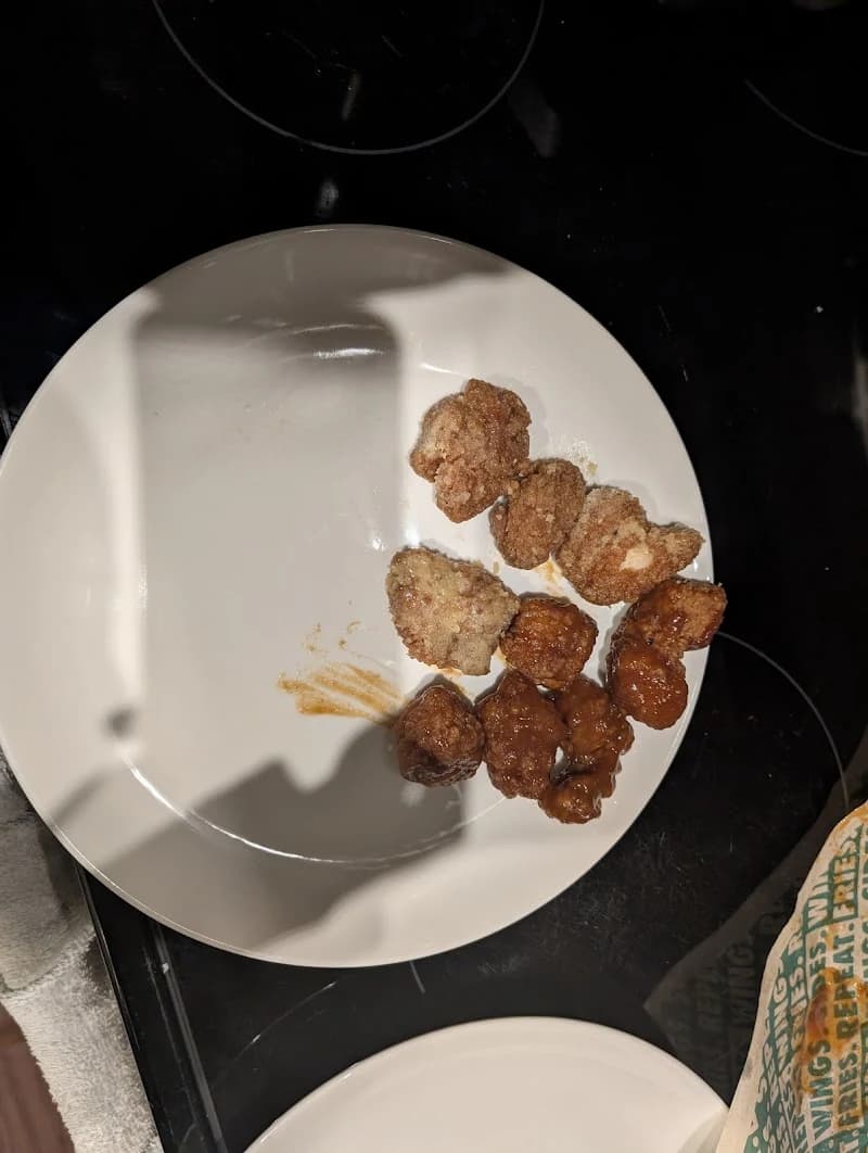 Wingstop storefront outside and inside view at 7107 NW Barry Rd. in Kansas City, Missouri