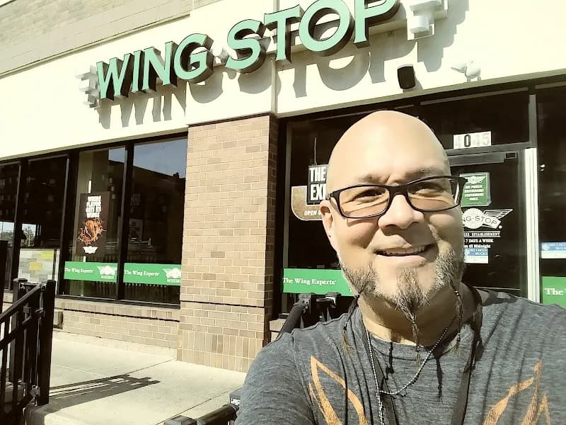 Wingstop storefront outside and inside view at 4045 Lindell Blvd in Saint Louis, Missouri