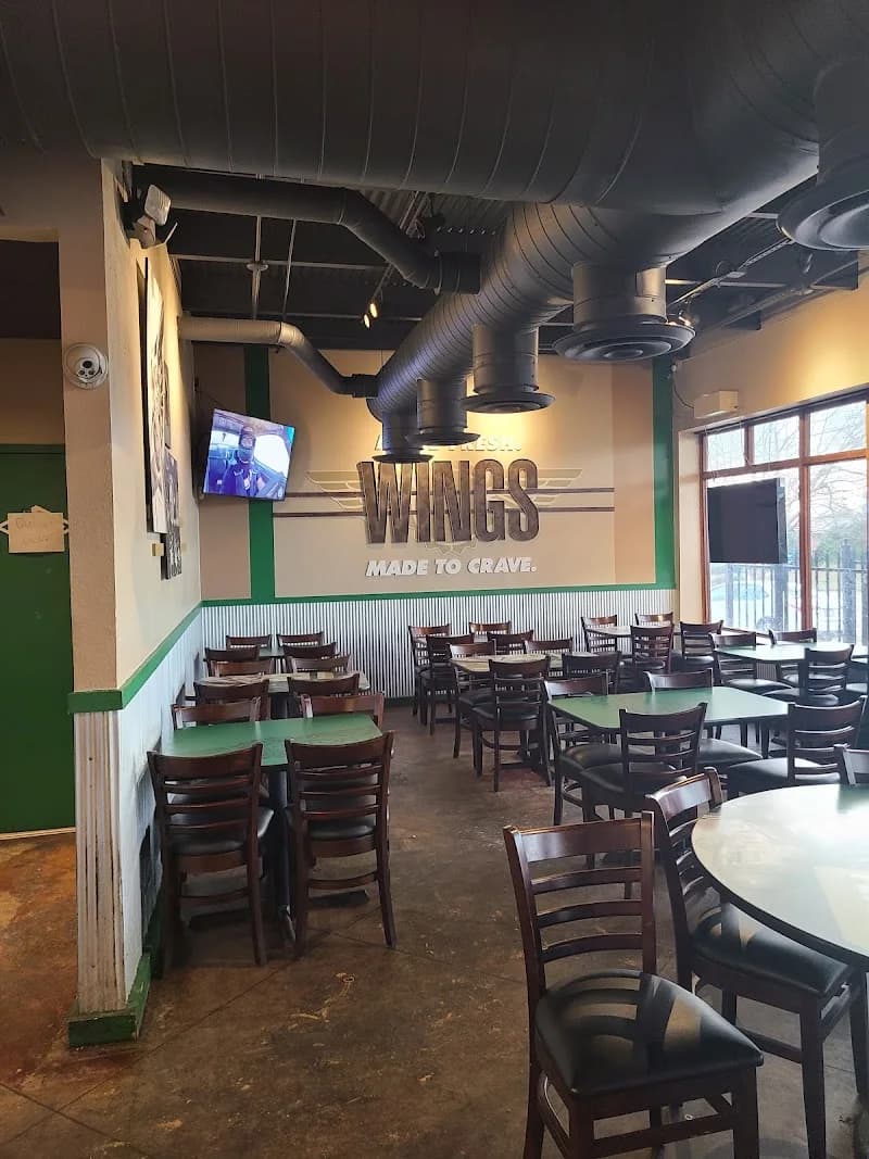 Wingstop storefront outside and inside view at 952 N State St in Jackson, Mississippi