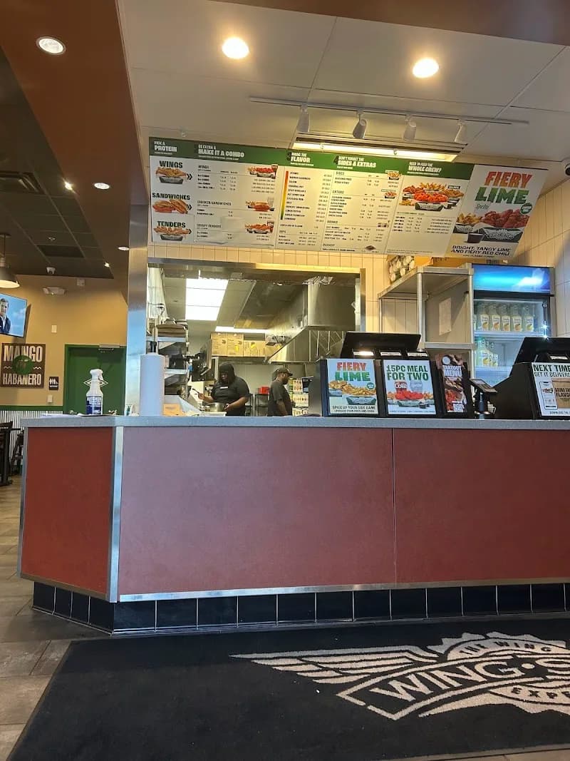 Wingstop storefront outside and inside view at 4104 Surles Ct Unit 8 in Durham, North Carolina