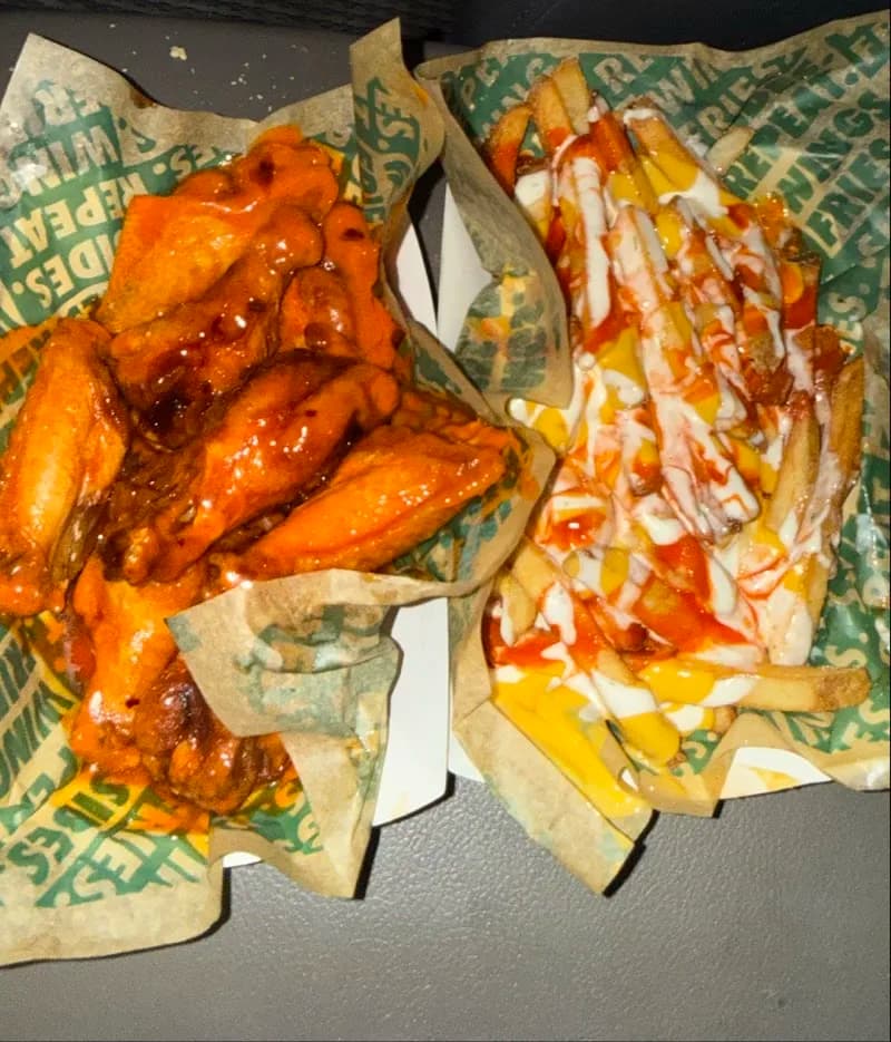 Wingstop storefront outside and inside view at 4500 Montevallo Road in Birmingham, Alabama