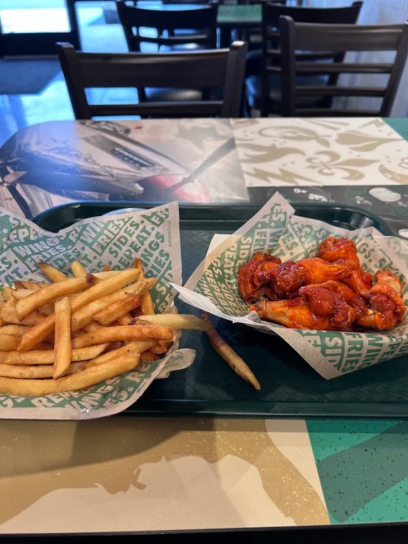 Wingstop storefront outside and inside view at 2130 Winchester Rd NE in Huntsville, Alabama