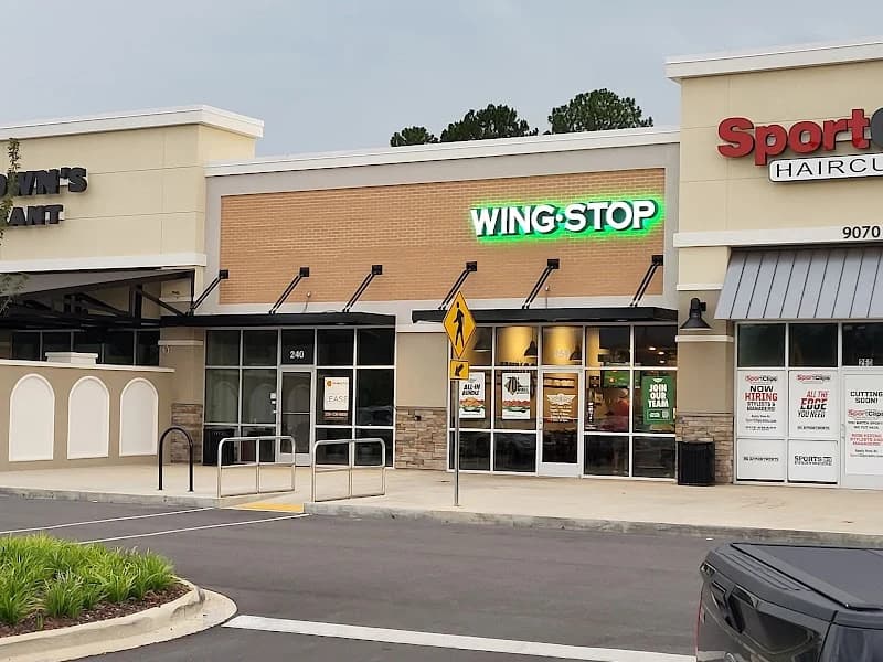 Wingstop storefront outside and inside view at 9070 S. Memorial Pkwy in Huntsville, Alabama