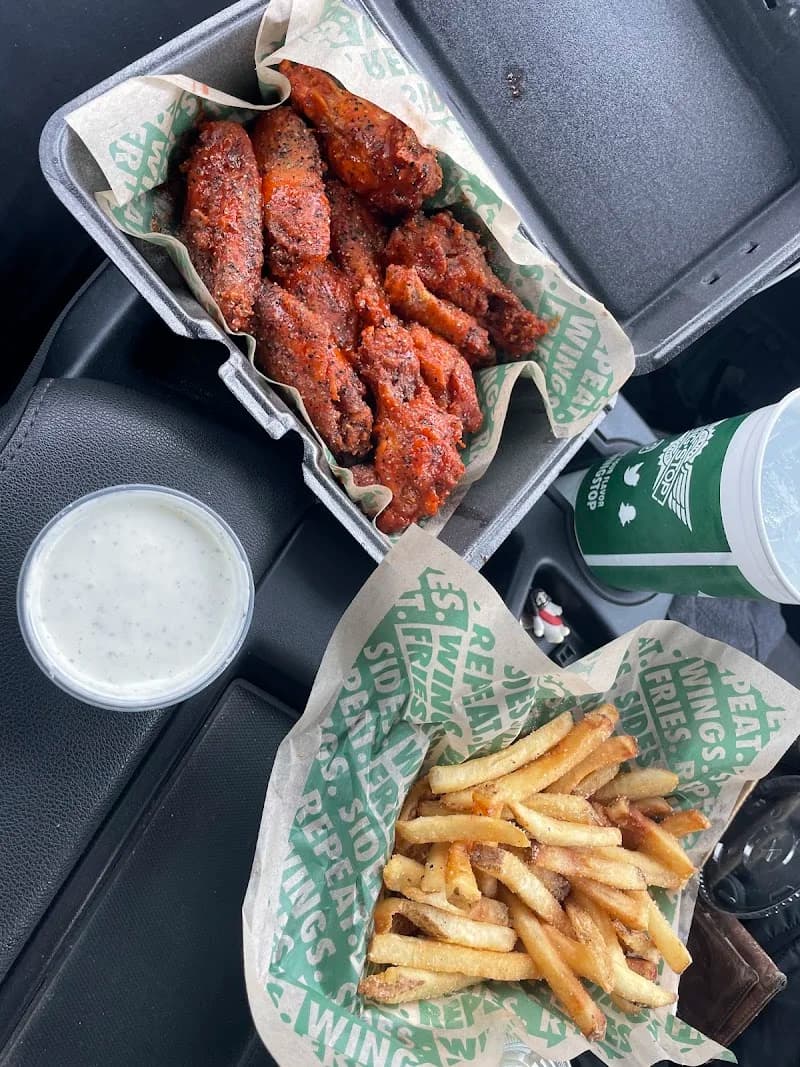 Wingstop storefront outside and inside view at 6518 Atlanta Highway in Montgomery, Alabama