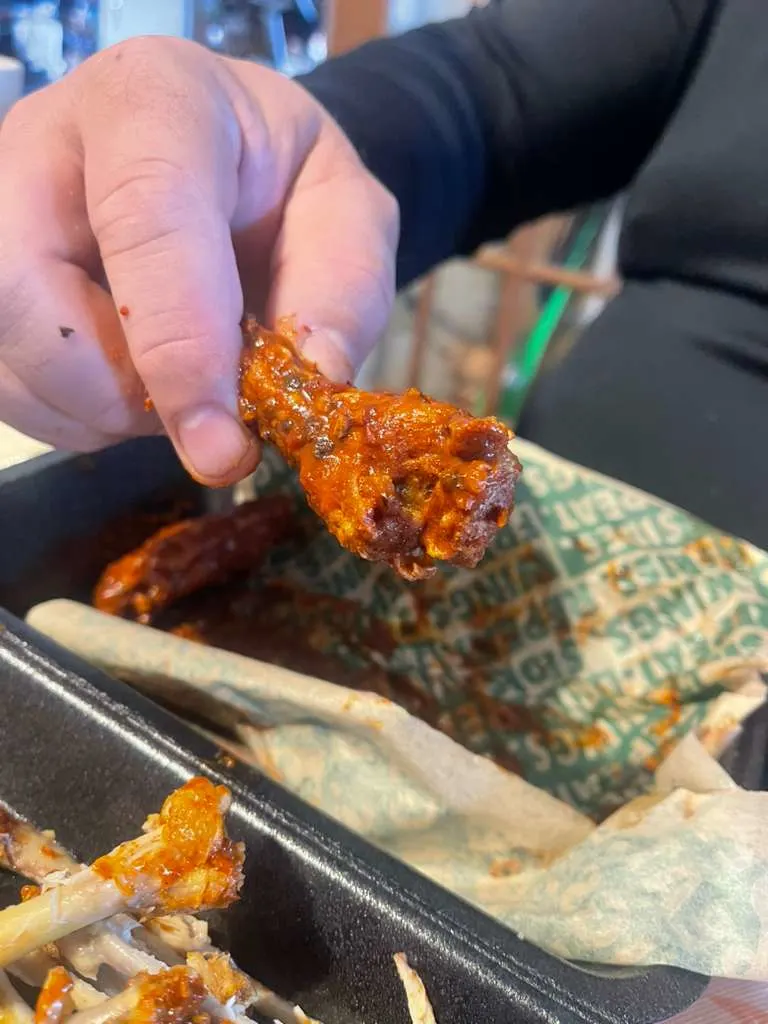 Wingstop storefront outside and inside view at 124 W Grand Ave in Rainbow City, Alabama