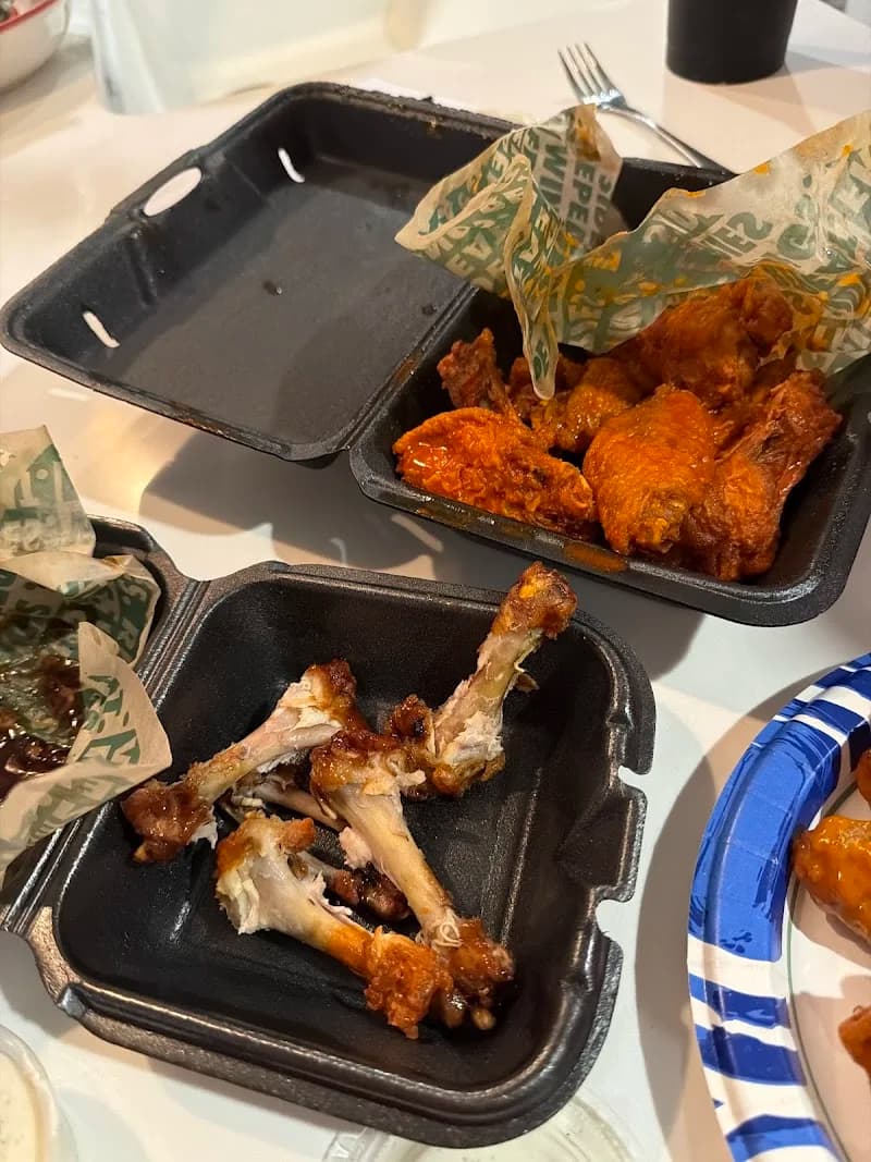 Wingstop storefront outside and inside view at 7268 Gadsden Hwy Suite 104 in Trussville, Alabama