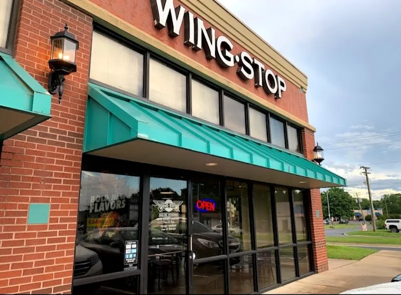Wingstop storefront outside and inside view at 2730 Prince St Ste 1 in Conway, Arkansas