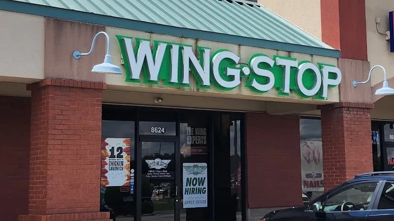 Wingstop storefront outside and inside view at 8624 Rogers Ave in Fort Smith, Arkansas