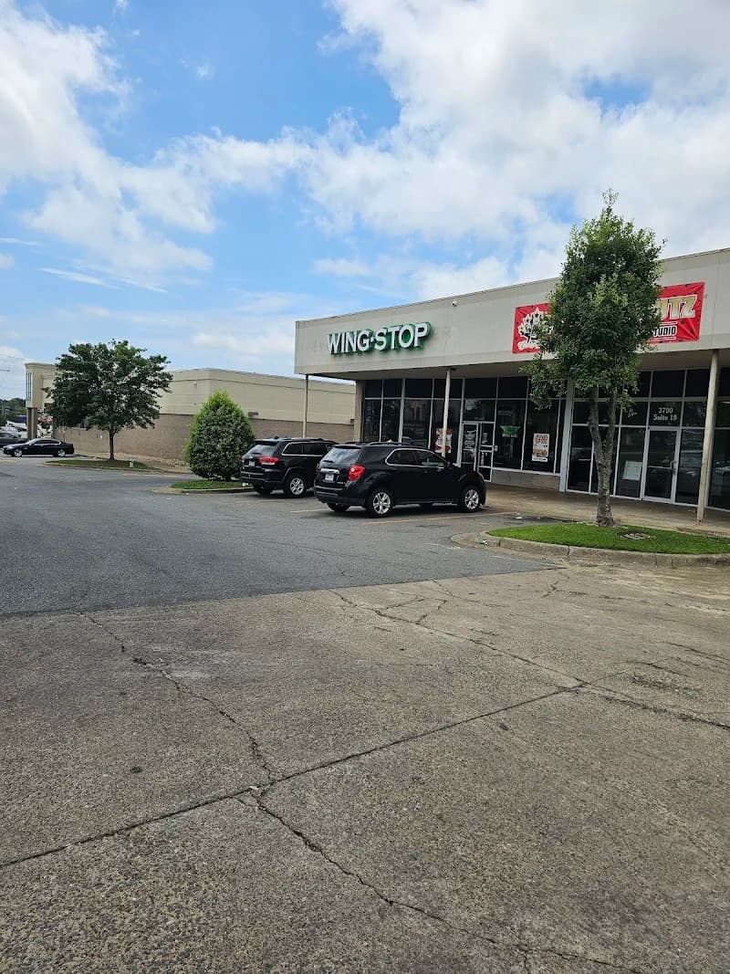 Wingstop storefront outside and inside view at 3700 S. University Ave in Little Rock, Arkansas
