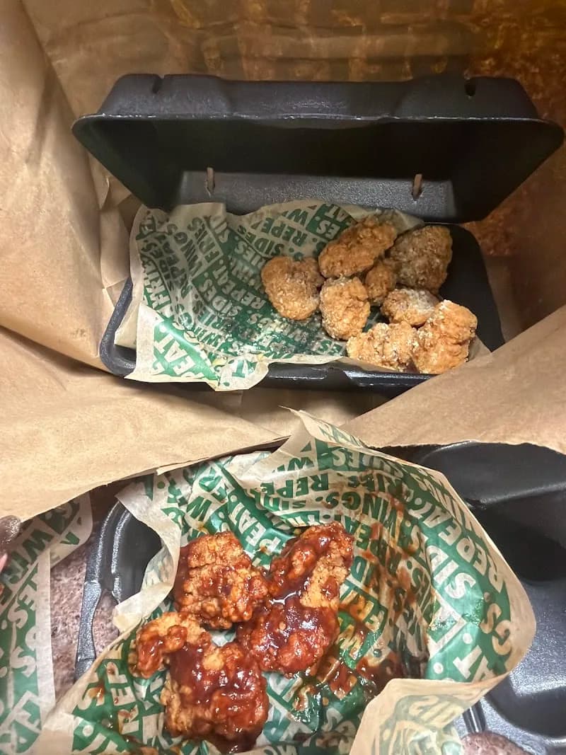 Wingstop storefront outside and inside view at 3200 E Hwy 412 50 in Siloam Springs, Arkansas