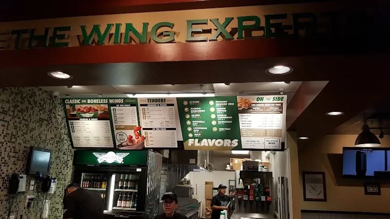 Wingstop storefront outside and inside view at 2815 W Peoria Ave in Phoenix, Arizona