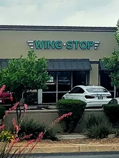 Wingstop storefront outside and inside view at 7942 E Broadway Blvd in Tucson, Arizona