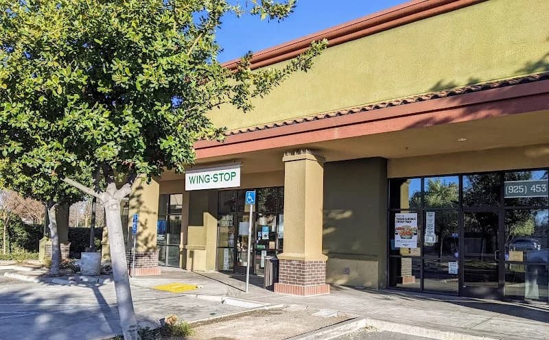 Wingstop storefront outside and inside view at 6471 Lone Tree Way in Brentwood, California