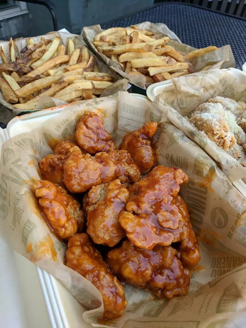 Wingstop storefront outside and inside view at 11445 South St in Cerritos, California