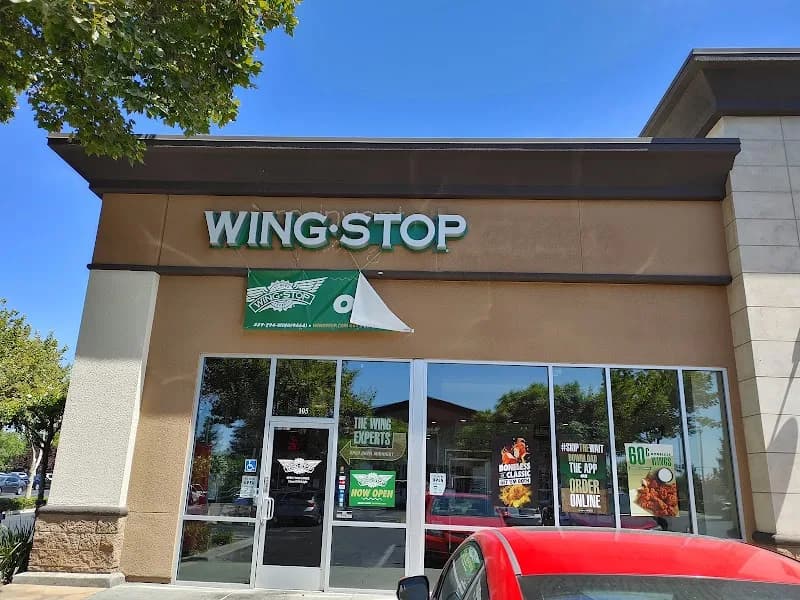 Wingstop storefront outside and inside view at 3140 Fowler Ave in Clovis, California