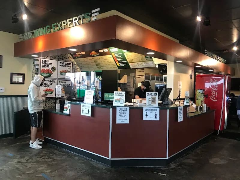 Wingstop storefront outside and inside view at 10015 Valley View St in Cypress, California