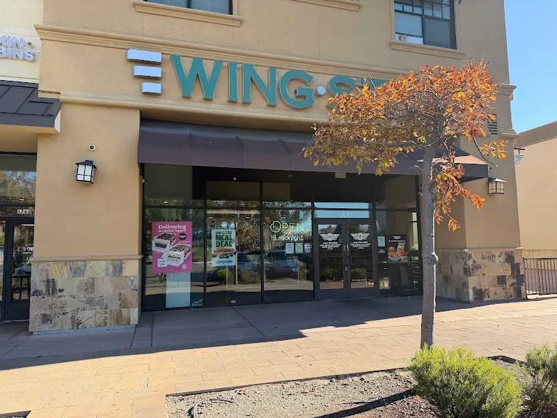 Wingstop storefront outside and inside view at 1765 E Bayshore Rd Ste 101 in East Palo Alto, California