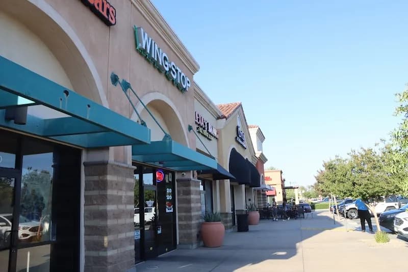 Wingstop storefront outside and inside view at 12552 Limonite Ave Ste 110 in Eastvale, California