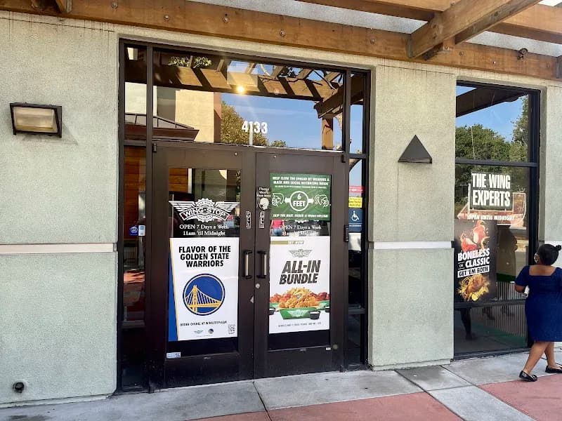 Wingstop storefront outside and inside view at 4133 San Pablo Ave in Emeryville, California