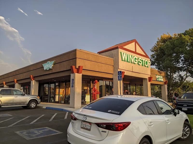 Wingstop storefront outside and inside view at 128 W. Nees Ave in Fresno, California