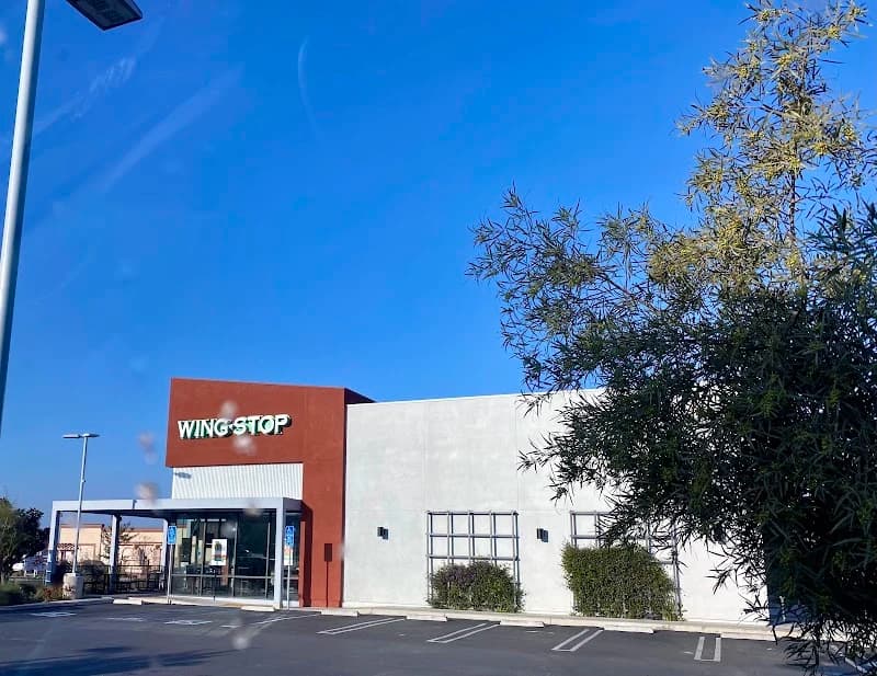 Wingstop storefront outside and inside view at 22200 Barton Road in Grand Terrace, California