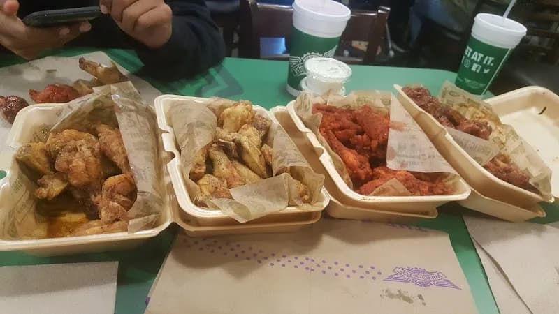 Wingstop storefront outside and inside view at 27993 Greenspot Road in Highland, California