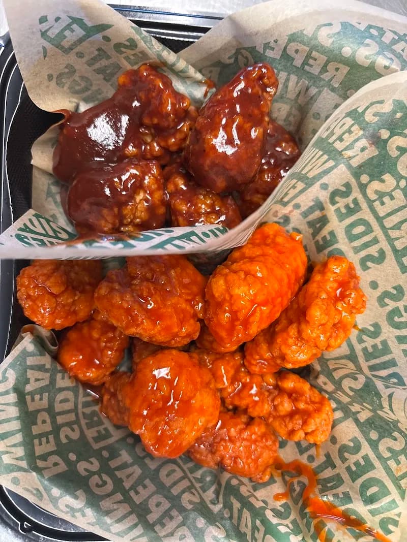 Wingstop storefront outside and inside view at 27993 Greenspot Road in Highland, California