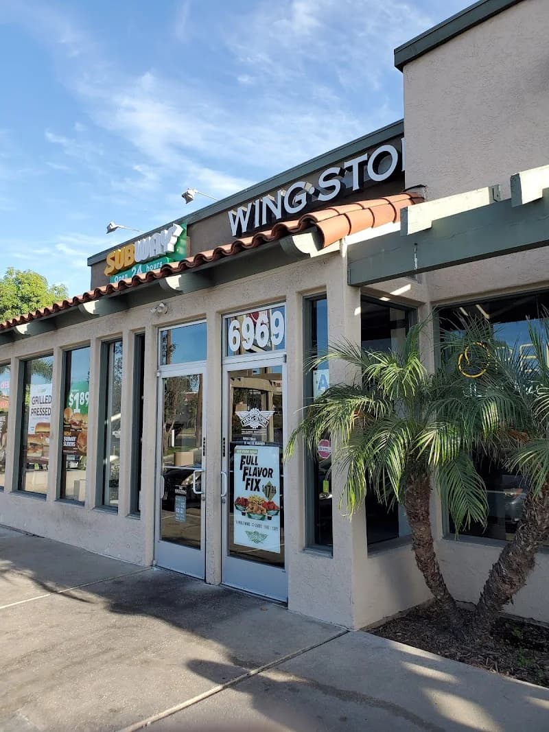 Wingstop storefront outside and inside view at 6969 Broadway in Lemon Grove, California