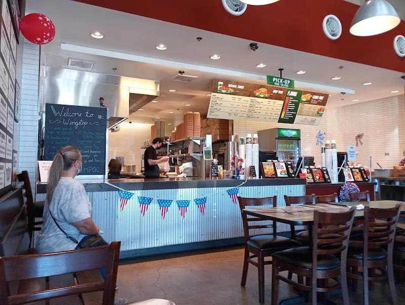 Wingstop storefront outside and inside view at 1413 North H Street in Lompoc, California