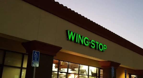 Wingstop storefront outside and inside view at 2018 E Carson St in Long Beach, California