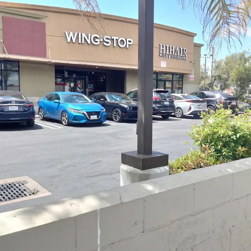 Wingstop storefront outside and inside view at 3825 Crenshaw Blvd Ste 104 in Los Angeles, California