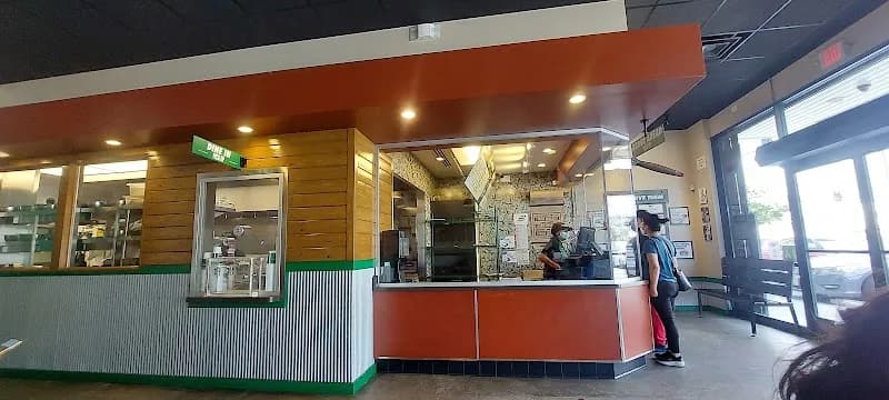 Wingstop storefront outside and inside view at 10007 S. Central Ave in Los Angeles, California