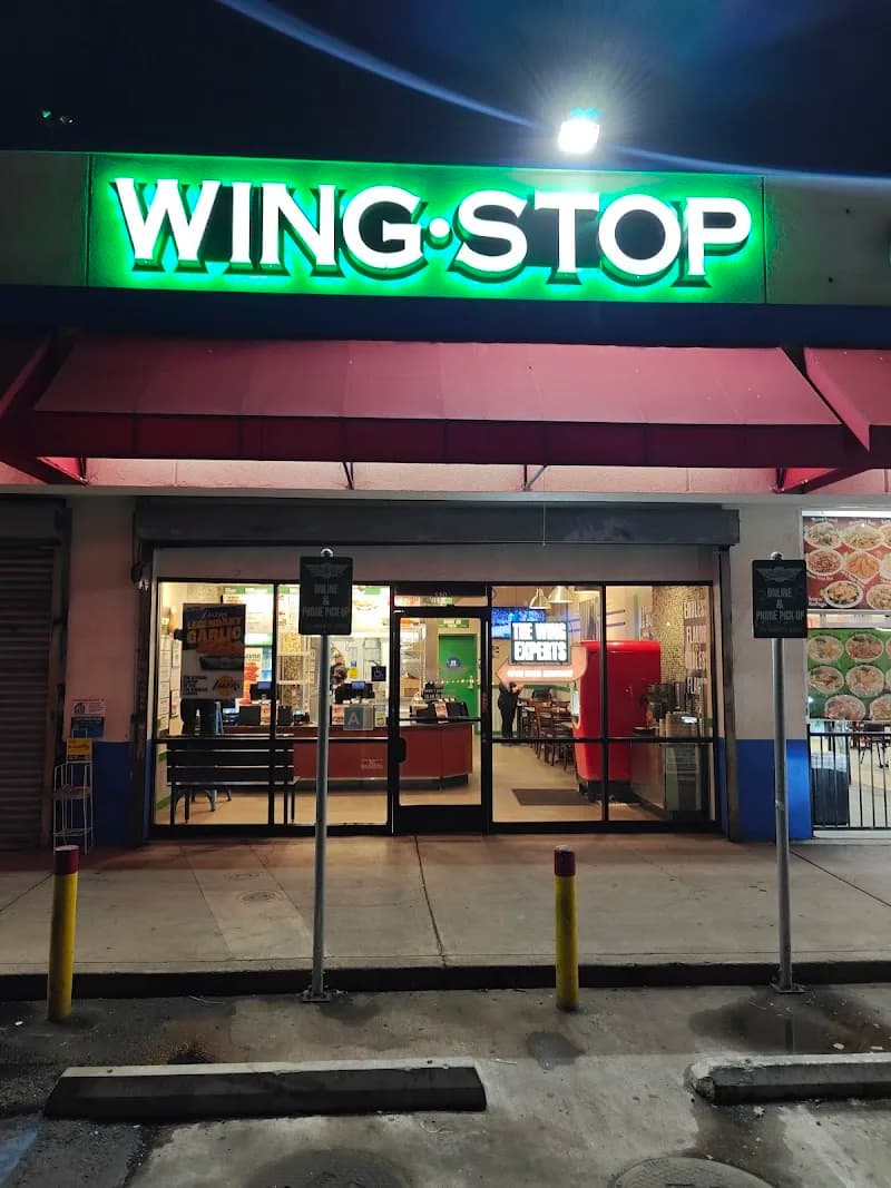 Wingstop storefront outside and inside view at 1713 E. Vernon Ave in Los Angeles, California