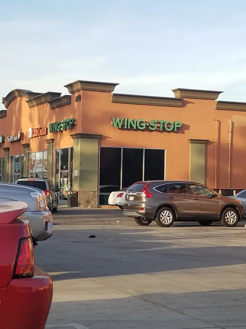 Wingstop storefront outside and inside view at 10910 Long Beach Blvd in Lynwood, California
