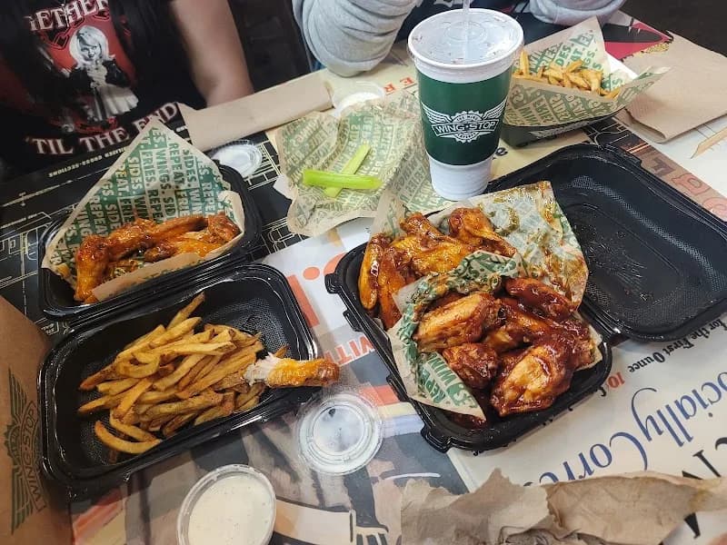 Wingstop storefront outside and inside view at 2180 W Cleveland Ave Ste 116 in Madera, California