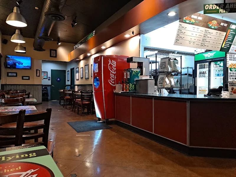 Wingstop storefront outside and inside view at 1342 E Yosemite Ave in Manteca, California