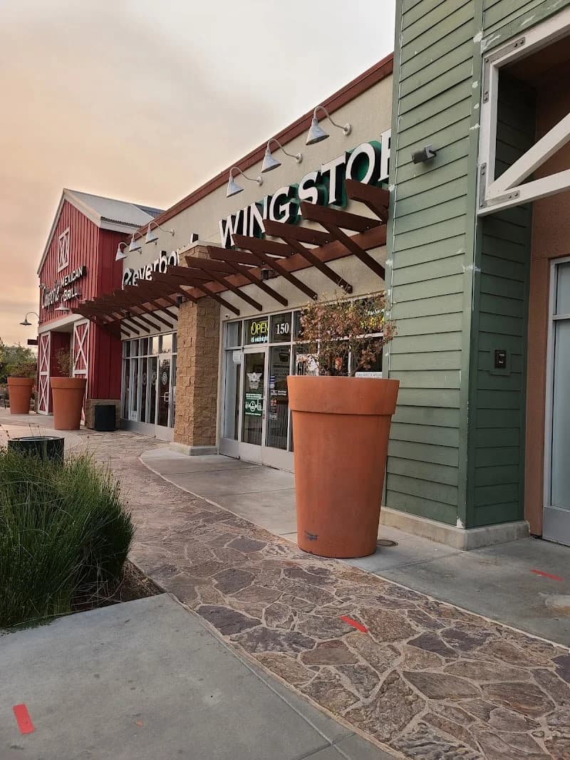 Wingstop storefront outside and inside view at 30024 Haun Rd in Menifee, California