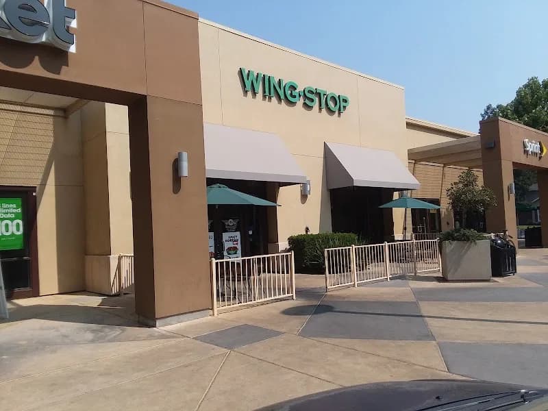 Wingstop storefront outside and inside view at 779 E Yosemite Ave Ste D in Merced, California