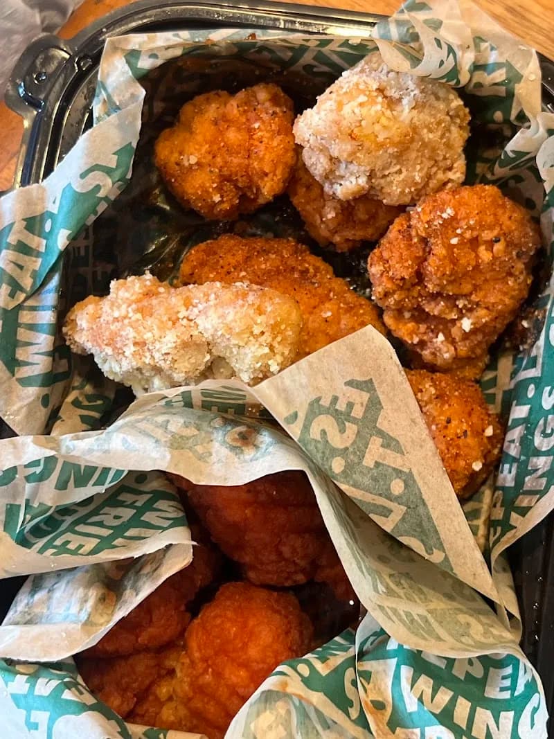 Wingstop storefront outside and inside view at 5160 Vineland Ave in North Hollywood, California