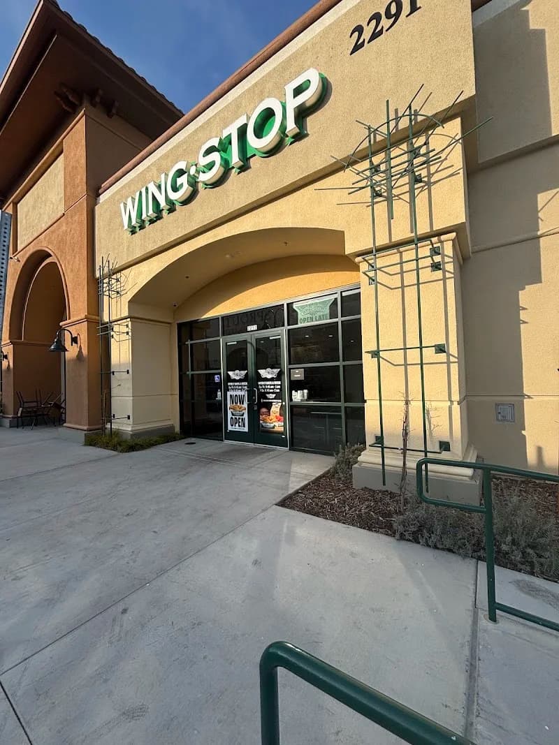 Wingstop storefront outside and inside view at 2251 West Leland Rd in Pittsburg, California