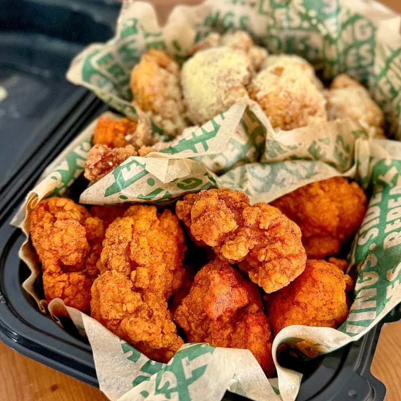 Wingstop storefront outside and inside view at 1668 Main St in Ramona, California