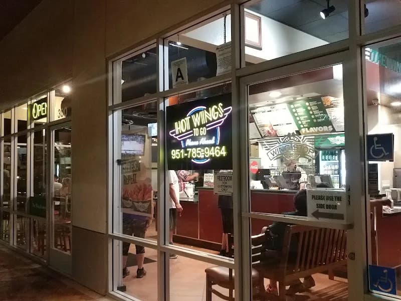 Wingstop storefront outside and inside view at 4290 Riverwalk Pkwy Ste 300 in Riverside, California