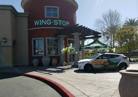 Wingstop storefront outside and inside view at 1760 S. Tippecanoe Ave in San Bernardino, California
