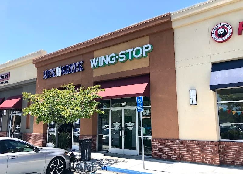 Wingstop storefront outside and inside view at 2015 Chess Drive in San Mateo, California