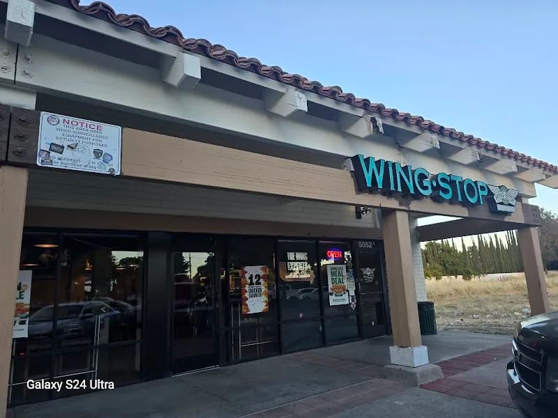 Wingstop storefront outside and inside view at 5052 West Ln in Stockton, California