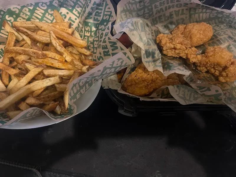 Wingstop storefront outside and inside view at 1578 Hillman St. in Tulare, California