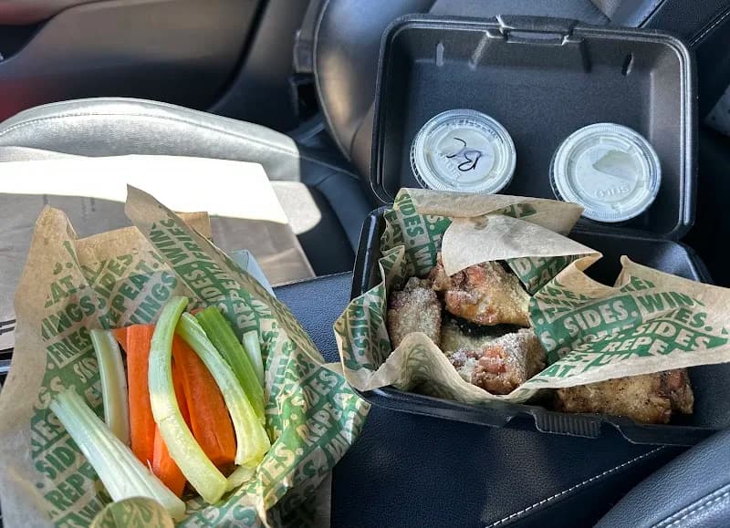 Wingstop storefront outside and inside view at 15683 Roy Rogers Dr. in Victorville, California