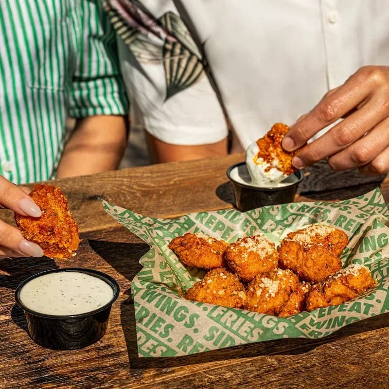 Wingstop storefront outside and inside view at 2015 N Dinuba Blvd in Visalia, California