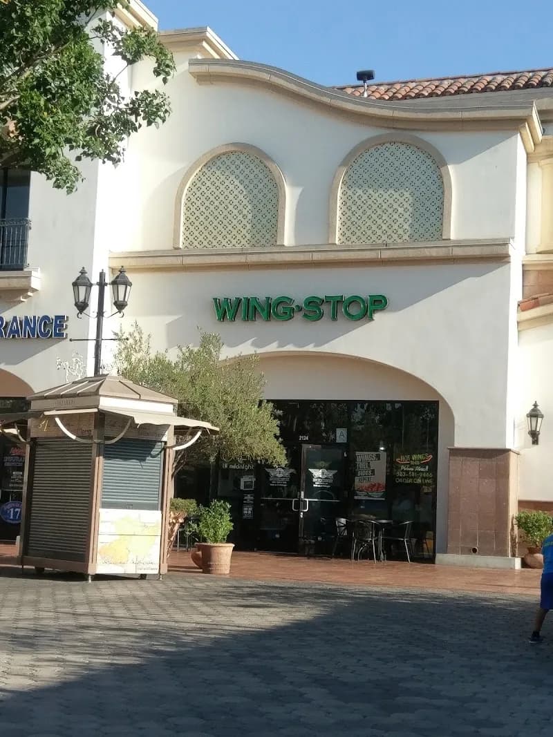 Wingstop storefront outside and inside view at 2124 E Florence Ave in Walnut Park, California